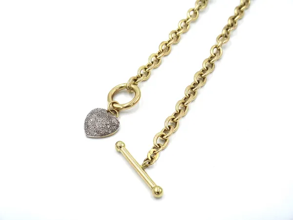 A 9ct gold and diamond necklace, the oval link chain with a T bar and loop clasp, fitted with a diamond set heart shaped pendant, gross weight 13gms.