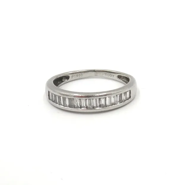 A platinum and diamond ring, mounted with a row of baguette diamonds, detailed PT950, ring size N.