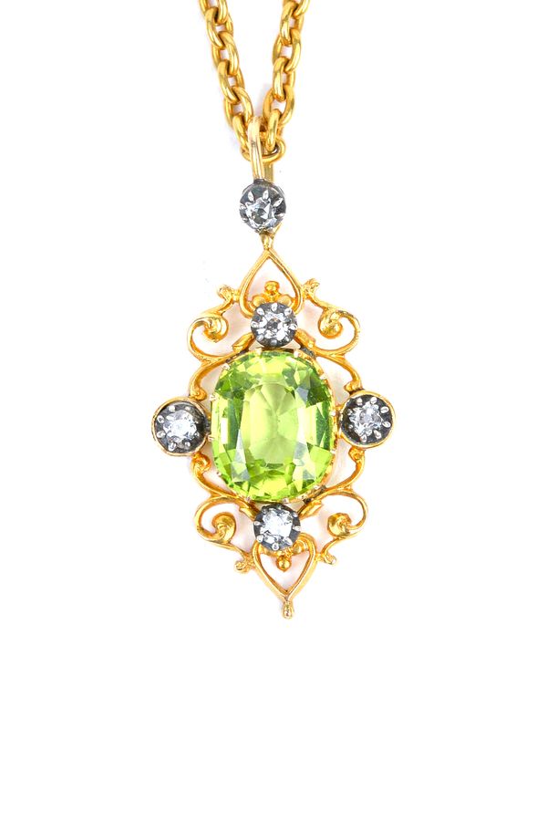 A peridot and diamond pendant, claw set with the cushion shaped peridot at the centre, within a scroll pierced surround, mounted with four cushion sha