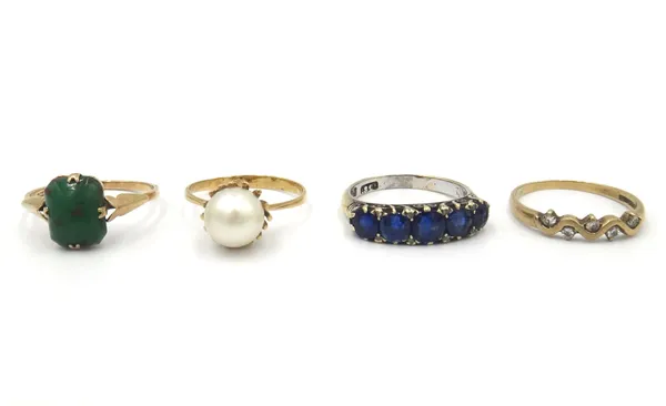 A gold and sapphire five stone ring, mounted with a row of graduated cushion shaped sapphire and with four pairs of rose diamond mounted at intervals,