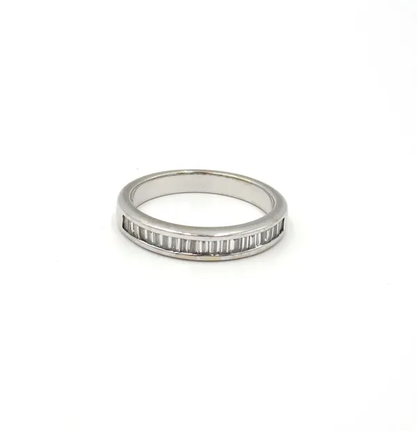 A white gold and diamond ring, mounted with a row of baguette diamonds, detailed 18K 750, ring size N 1/2.