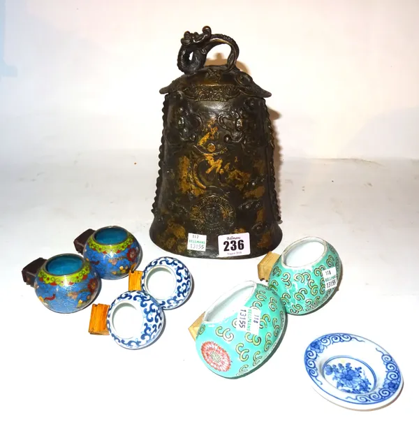 Asian collectables, including; a south east Asian gong with dragon finial, 21cm and six Chinese bird feeders, (qty).   CAB