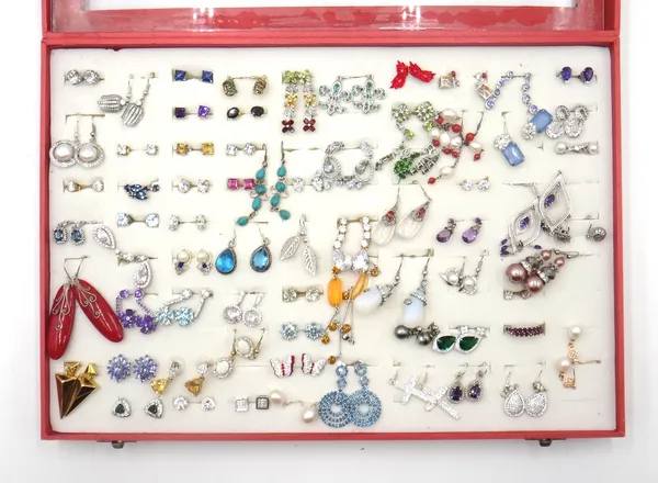 A large collection of mostly silver and gem set earrings, mostly detailed 925 and also a quantity of pairs of costume earrings, displayed in two cases