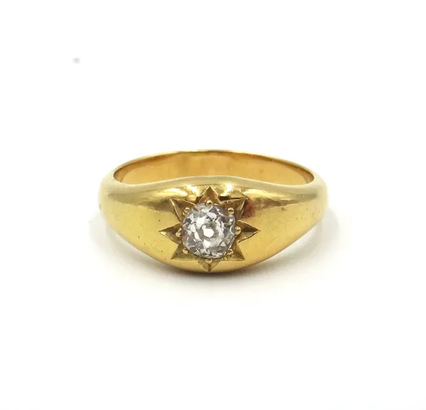 A gold and diamond single stone ring, star gypsy set  with a cushion shaped diamond, detailed 18 CT, ring size P and a half.