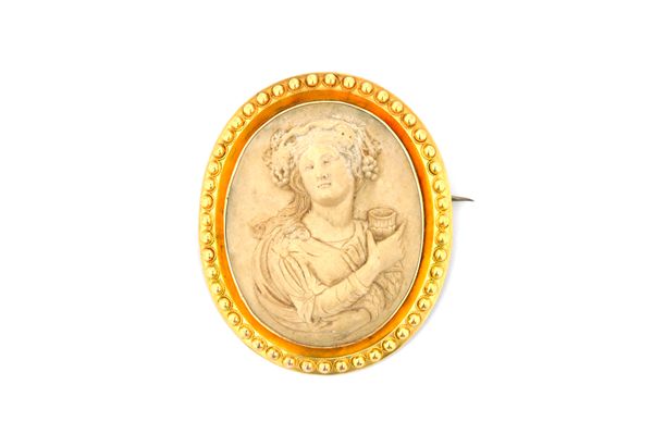 A Victorian gold mounted oval lava cameo brooch, carved as a classical female figure within a beaded surround and a pair of Victorian gold mounted ova