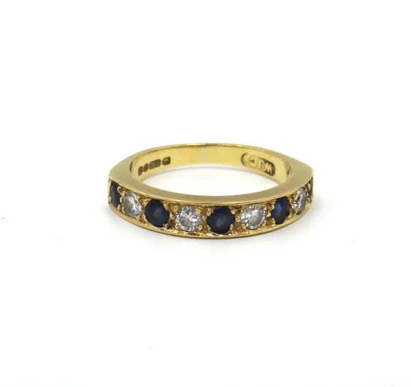 An 18ct gold, sapphire and diamond nine stone half hoop eternity ring, mounted with five circular cut sapphires, alternating with four circular cut di