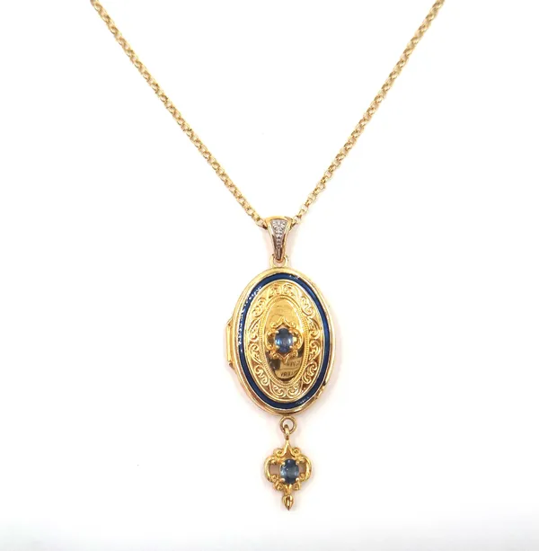 A 14ct gold, sapphire and diamond set oval pendant locket, claw set with an oval cut sapphire to the centre and with an oval cut sapphire to the drop,