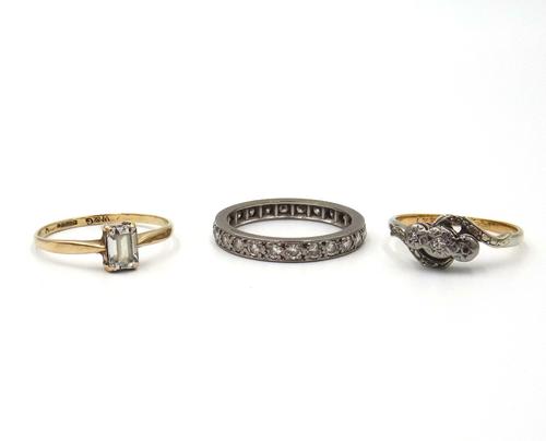 A diamond set full eternity ring, mounted with circular cut diamonds, a gold and platinum ring, mounted with two diamonds (the third diamond lacking),
