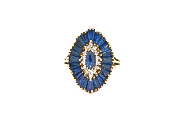 An 18ct gold, sapphire and diamond cluster ring, mounted with a marquise shaped sapphire to the centre, in a surround of circular cut diamonds and wit