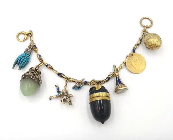 A gold and blue enamelled bracelet, with a boltring clasp, fitted with eight pendants and charms, including; a turquoise and rose diamond set hand, an