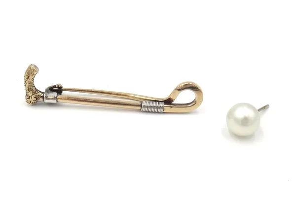 A gold brooch, designed as a riding crop, detailed 15 CT, weight 4.1 gms and one cultured pearl earstud, having a post fitting, (2).