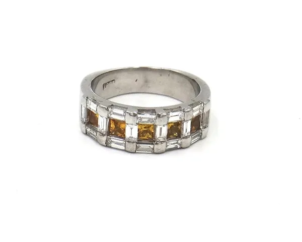 A white gold, diamond and yellow gem set half hoop ring, mounted to the centre with a row of five square cut yellow gemstones, otherwise mounted with