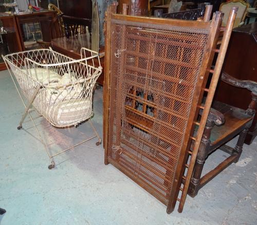 An early 20th century beech framed child's crib and a white painted metal child's crib (2).  BAY 1