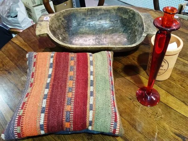 A 20th century dug out hardwood twin handled bowl, 52cm wide and a terracotta wine cooler, a glass candlestick and a cushion, (4).   BAY 1