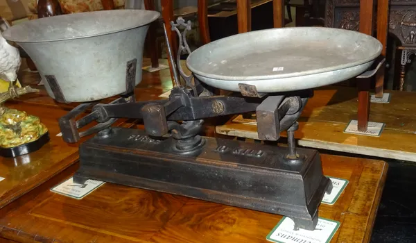 A set of early 20th century cast iron kitchen balance scales with metal bowls, 66cm wide.   H6