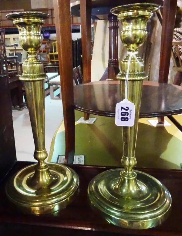 A pair of brass candlesticks with detachable sconces, in the 18th century style, 27cm high.  F6