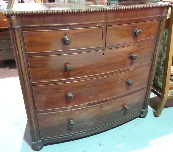 A 19th century mahogany bowfront chest of two short and three long graduated drawers on turned supports, 120cm wide.   J5