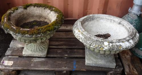 A matched pair of early 20th century reconstituted stone garden urns with egg and dart decoration, 57cm wide x 52cm high, (2)  OUT