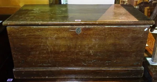 A 20th century stained pine lift top trunk, 70cm wide x 49cm high.  F9