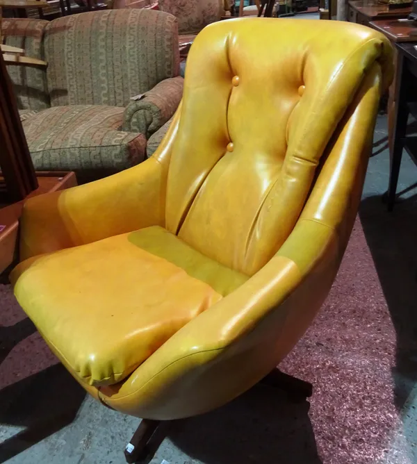 A 20th century "Egg" style armchair with faux leather upholstery.   I4