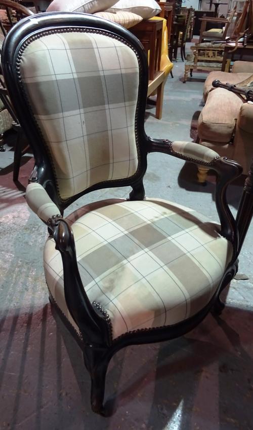 A 19th century mahogany spoonback open armchair, 84cm wide x 103cm high.  I3