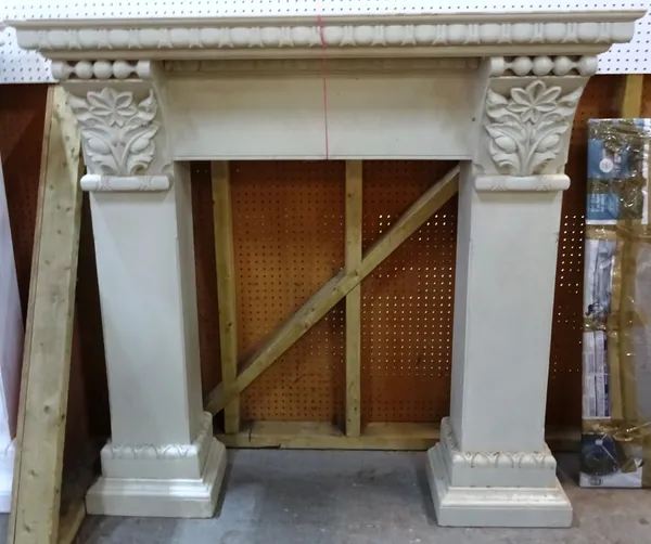 A 20th century white painted fire surround with floral and egg and dart decoration, 140cm wide x 139cm high, aperture 78cm wide x 104cm high. EXTRA