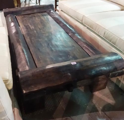 An early 20th century African hardwood low table on dual end supports, 180cm wide x 45cm high.  F7