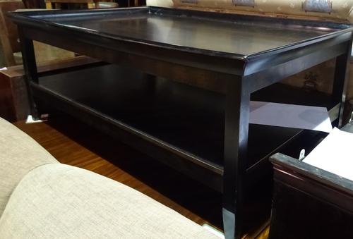 A 20th century hardwood two tier coffee table with galleried top on tapering supports, 109cm wide x 51cm high, together with a matching slatted bench,