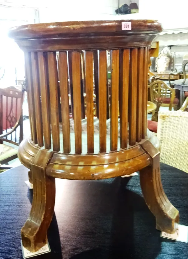 A large 18th century style circular jardiniere, with open slatted body, on four downswept supports, 74cm wide x 77cm high.  E6