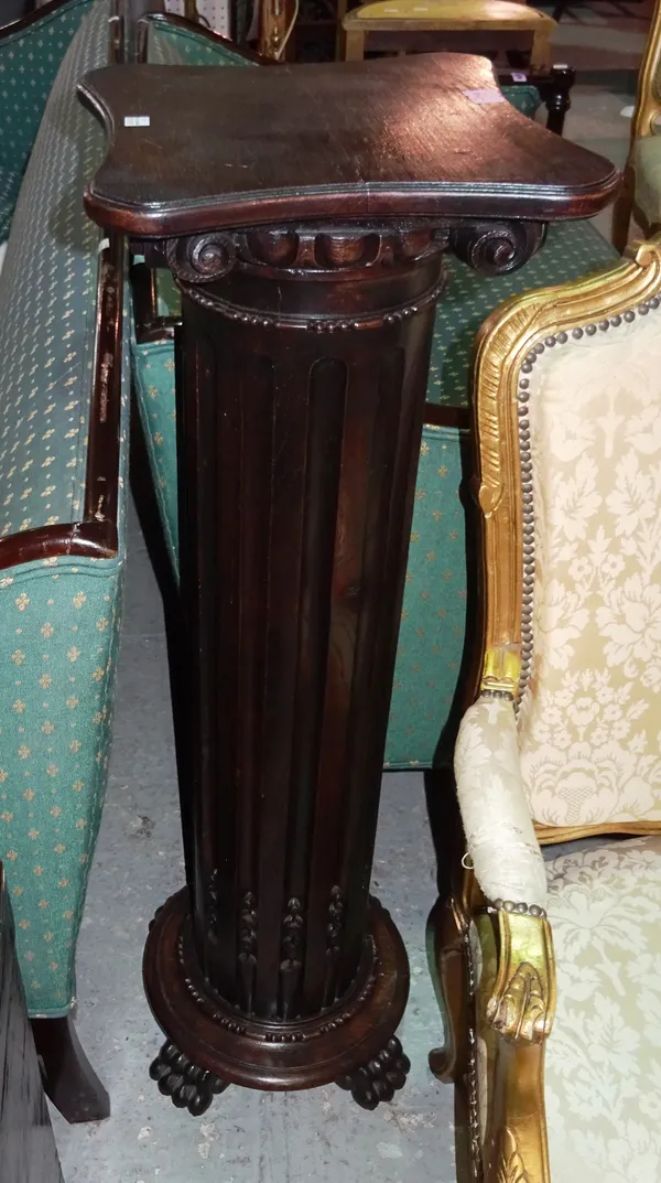 A 19th century stained oak pedestal, of ionic column form, on four paw feet, 34cm diameter x 104cm high.  D4