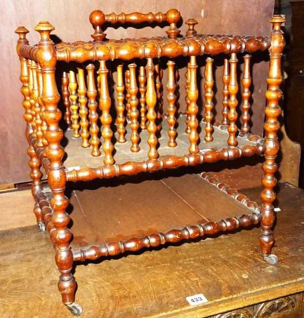 A 19th century French bobbin turned fruitwood four division Canterbury with platform undertier, 41cm wide x 46cm high x 34cm deep.  E8