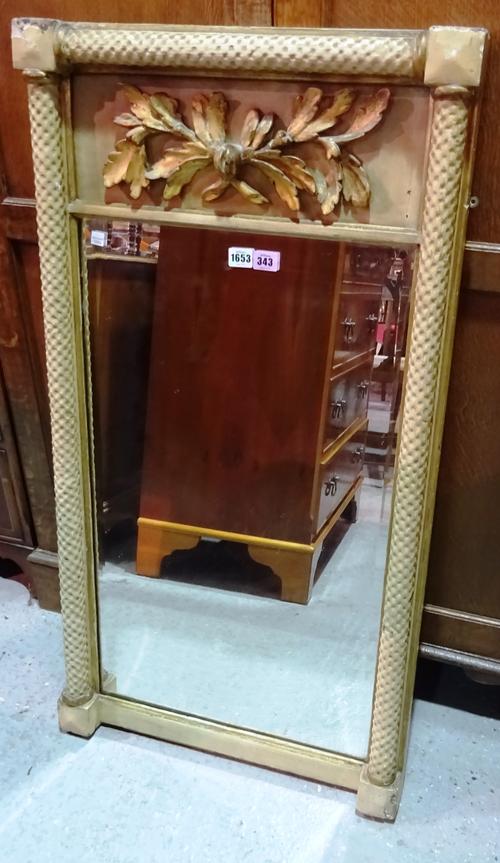An early 19th century pier glass, the upper frieze relief moulded with floral sprays, above a rectangular plate flanked by dimple moulded columns, 55c