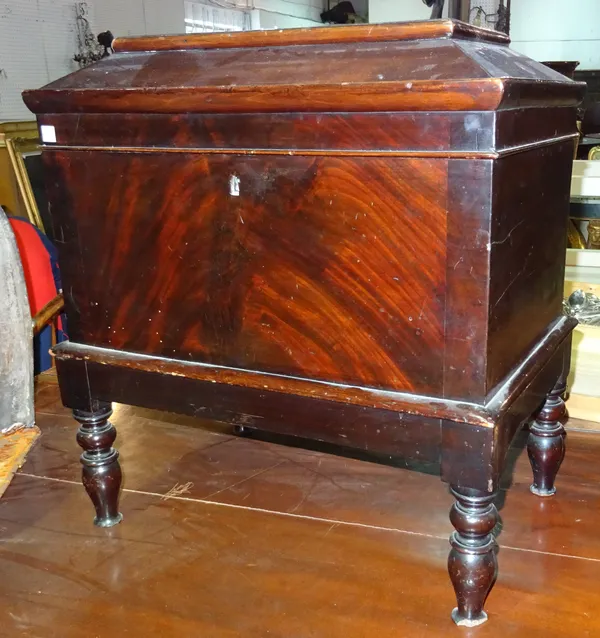 An early 19th century mahogany cellarette, with rectangular caddy top on turned supports, 55cm wide x 61cm high x 35cm deep.   BAY 1