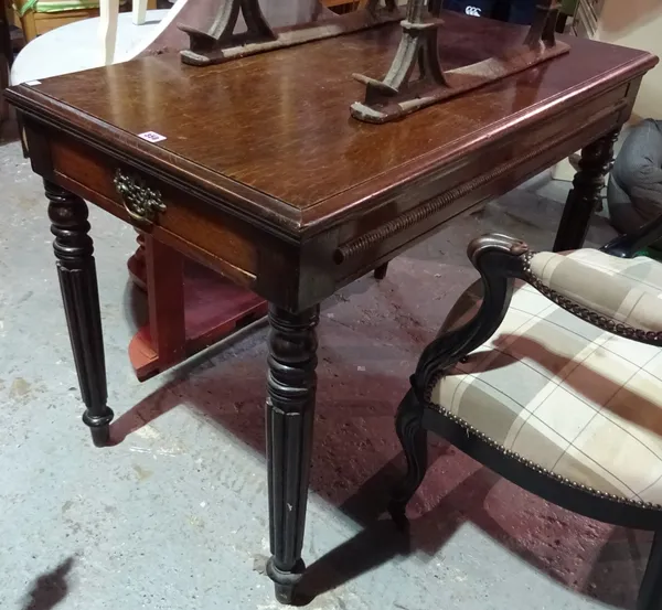 A 19th century oak centre table on tapering reeded supports, 107cm wide x 74cm high.  BAY 3