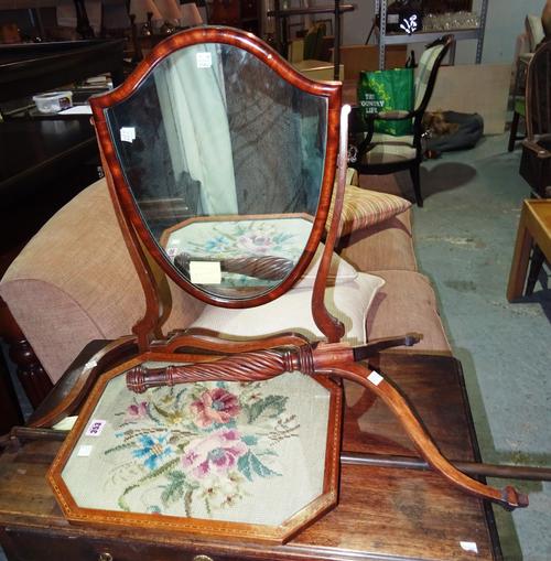 A Regency mahogany pole screen on tripod base, (a.f), and a shield shape mahogany toilet mirror, 40cm wide (2).  J4