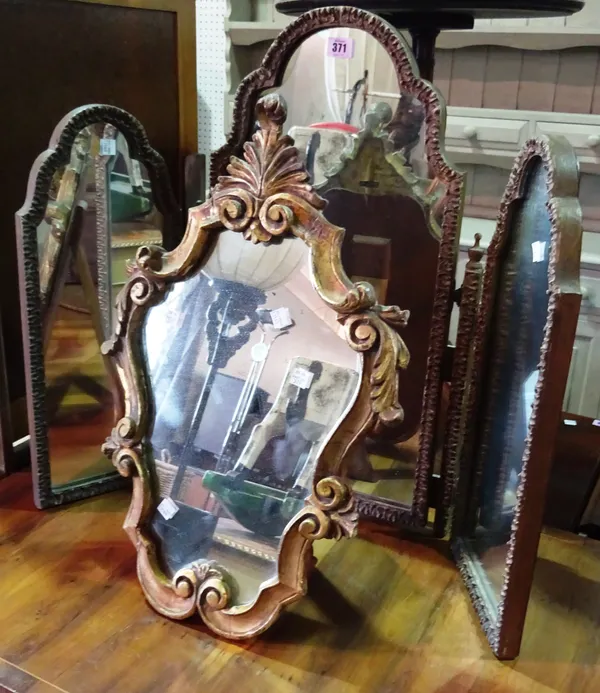 A gilt strut-back mirror and a folding three leaf dressing table mirror, (2).  C9