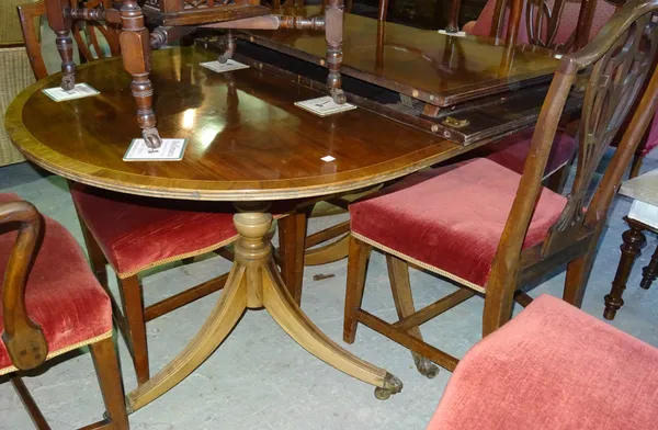A reproduction mahogany D-end twin pedestal dining table with two leaves, 150cm wide, 190cm fully extended.  D7