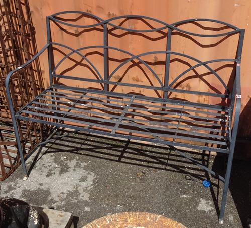 A 20th century black painted metal garden bench, 115cm wide x 92cm high.  OUT