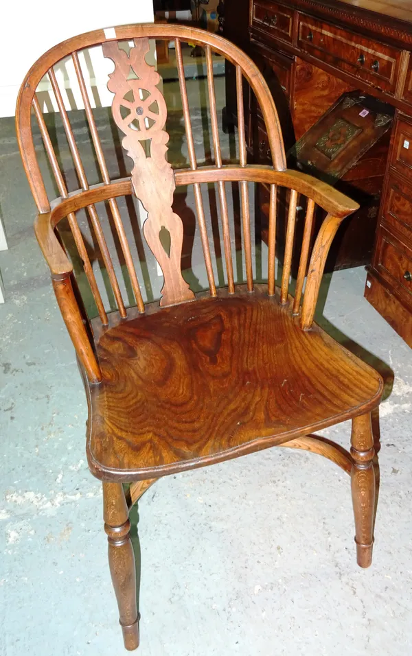 A 19th century ash and elm Windsor chair with crinoline stretcher, 46cm wide x 87cm high.  C4