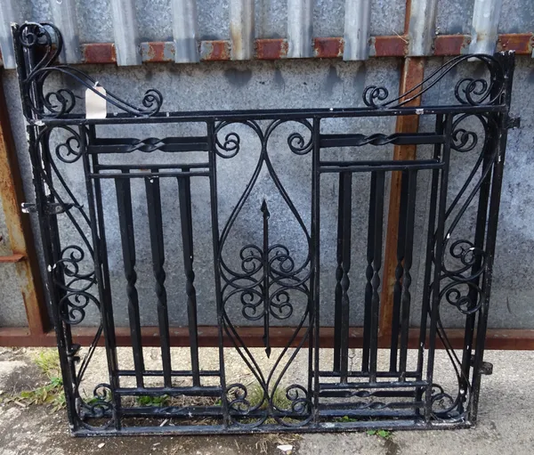 A pair of early 20th century black painted wrought iron gate posts, 125cm wide x 116cm high (2).   OUT
