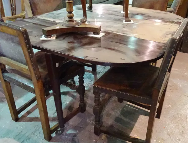 A 19th century French mahogany drop flap dining table on tapering supports.   B5