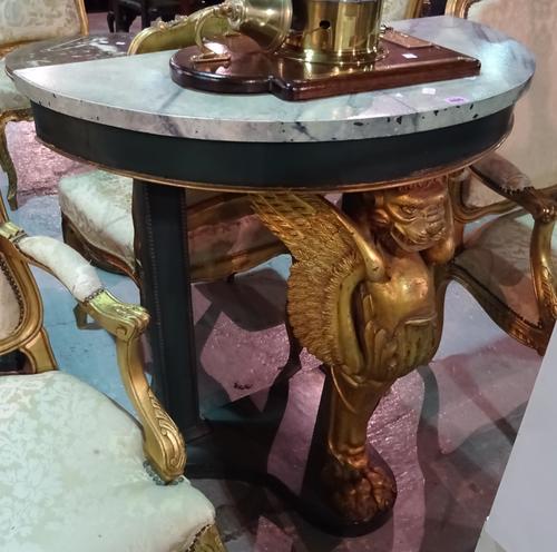 A 20th century console table, the faux marble demi-lune top on a winged lion monopodia support, 87cm x 85cm high.  E4
