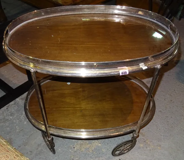 A n early 20th century silver plated serving serving trolley, fitted with two oval gallery trays, 75cm wide.   H4