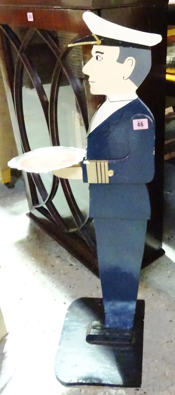 A 20th century dumb waiter formed as a ships captain, 90cm high.   L5