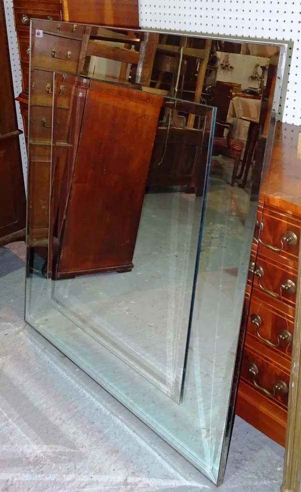 A 20th century bevelled glass cushion framed mirror 95cm wide x 110cm high and a smaller mirror.  MIRR