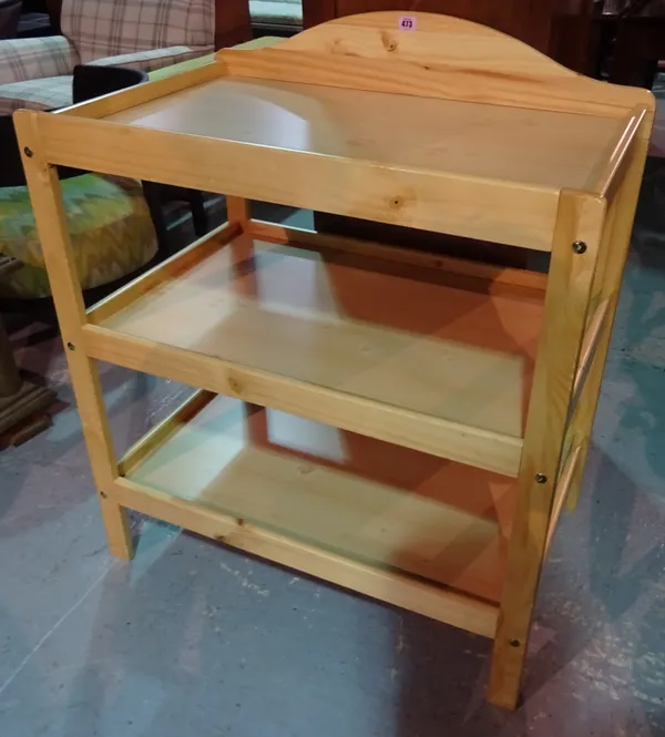 Mothercare; a three tier pine baby changer, 78cm wide x 90cm high. H8