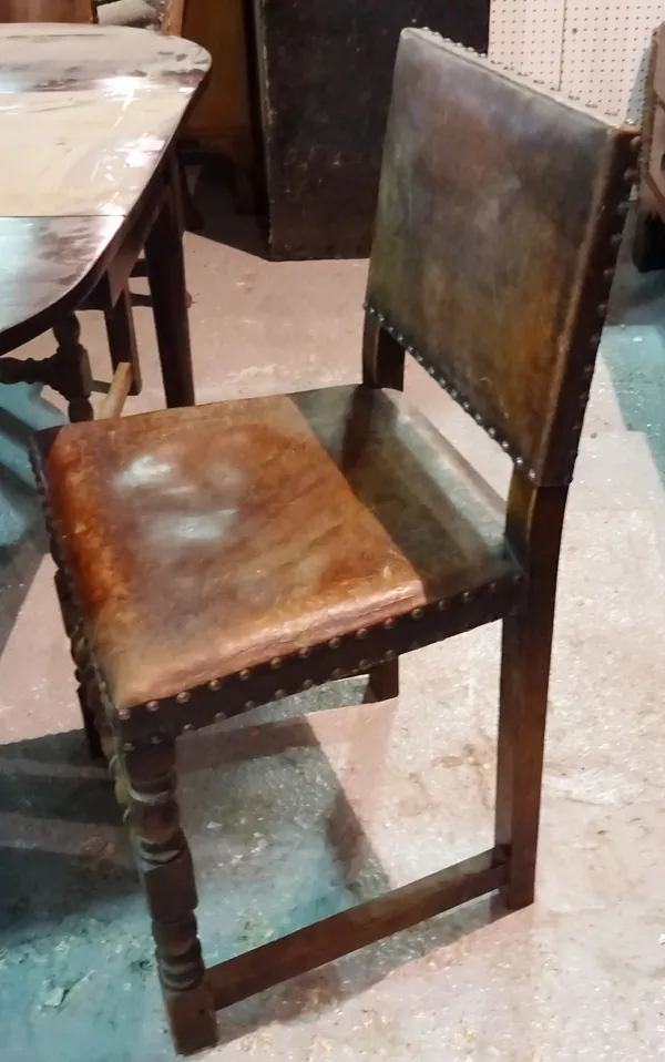 A set of four 18th century style oak dining chairs with studded leather upholstery (4).  B5