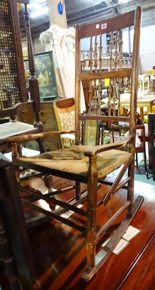 An early 20th century beech and faux bamboo rocking chair.  H7