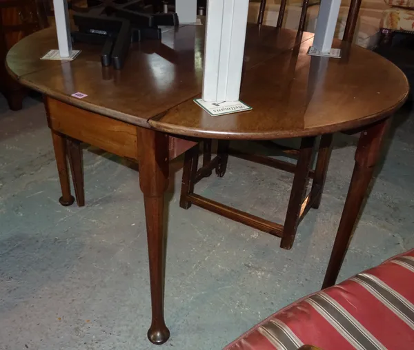 A George III mahogany drop-flap table on pad feet, 110cm wide x 70cm high.  G8