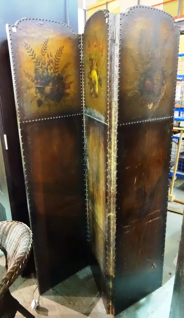 An early 20th century studded leather three fold screen, 135cm wide x 179cm high.  F6